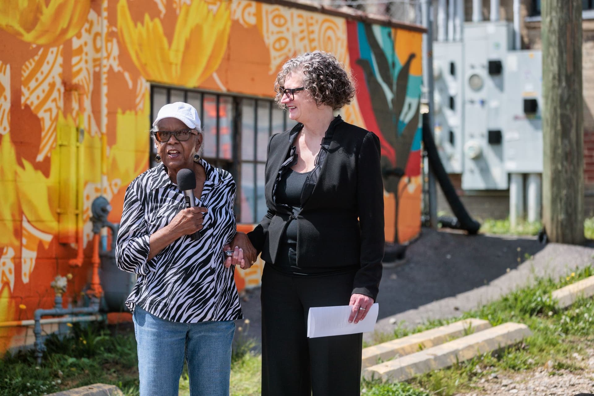 Catherine Mitchell of River Front Development Group providing remarks alongside Vic Isley CEO and President of Explore Asheville and the Buncombe County Tourism Development Authority. Photo Credit: Reggie Tidwell.
