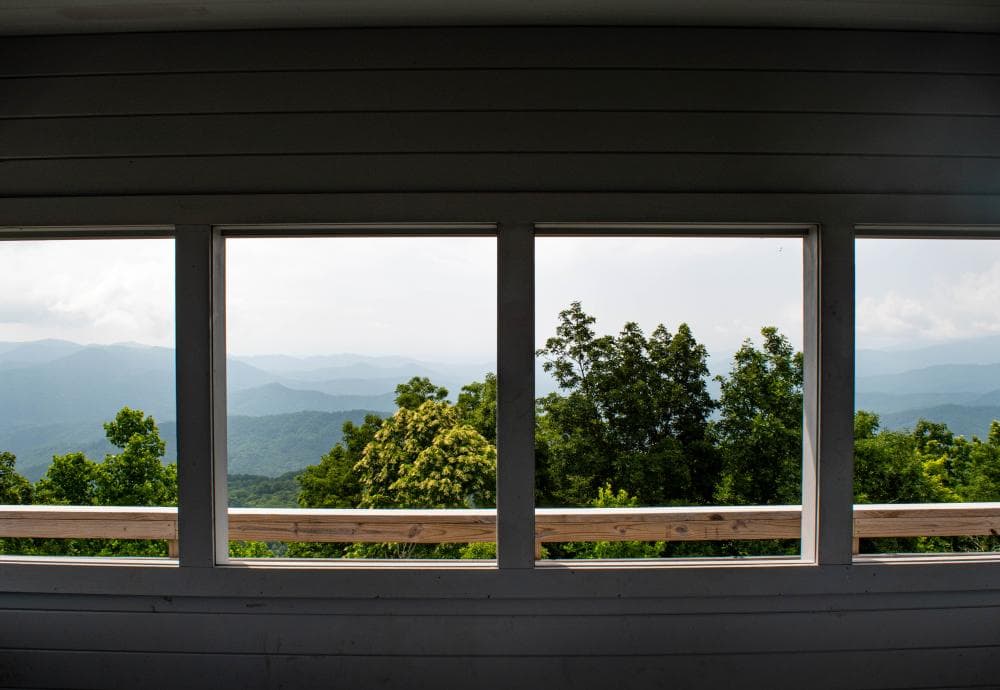 The view from inside the cab of the Rich Mountain Fire Tower on the Appalachian Trail. The view from inside the cab of the Rich Mountain Fire Tower on the Appalachian Trail.