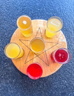 Six glasses of buchi arranged on a star at Rosetta's Kitchen Six glasses of buchi arranged on a star at Rosetta's Kitchen