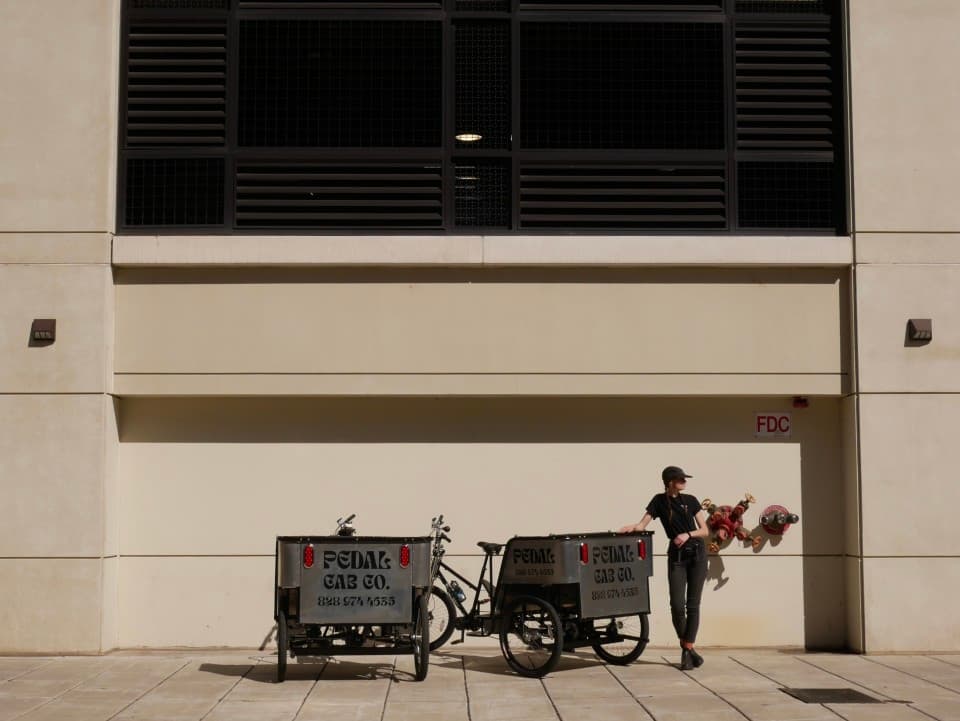 At Pedal Cab Company we strive to keep our transportation affordable and accessible to all. A-to-B rides are offered on a sliding pay scale. Whatever works for our passengers, works for us! Currently we have two pedicabs in operation. Each cab can carry 3 adults comfortably. If you would like to schedule a ride, email us at pedalcabcompany@gmail.com or flag us down when the urge for adventures strikes! At Pedal Cab Company we strive to keep our transportation affordable and accessible to all. A-to-B rides are offered on a sliding pay scale. Whatever works for our passengers, works for us! Currently we have two pedicabs in operation. Each cab can carry 3 adults comfortably. If you would like to schedule a ride, email us at pedalcabcompany@gmail.com or flag us down when the urge for adventures strikes!