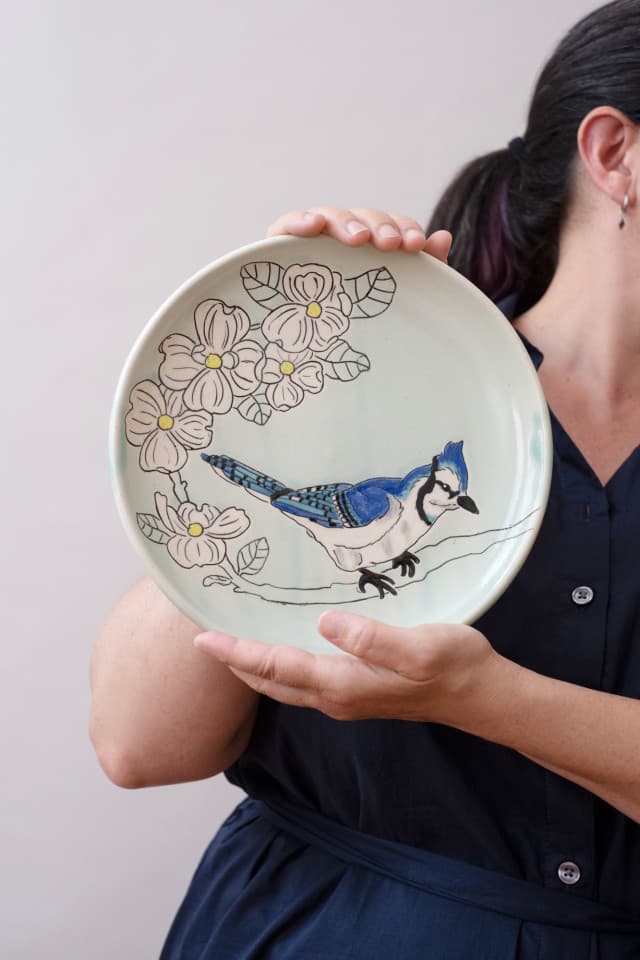 Handmade plate with a blue jay bird and dogwood blooms. Mishima inlay decoration. Handmade plate with a blue jay bird and dogwood blooms. Mishima inlay decoration.
