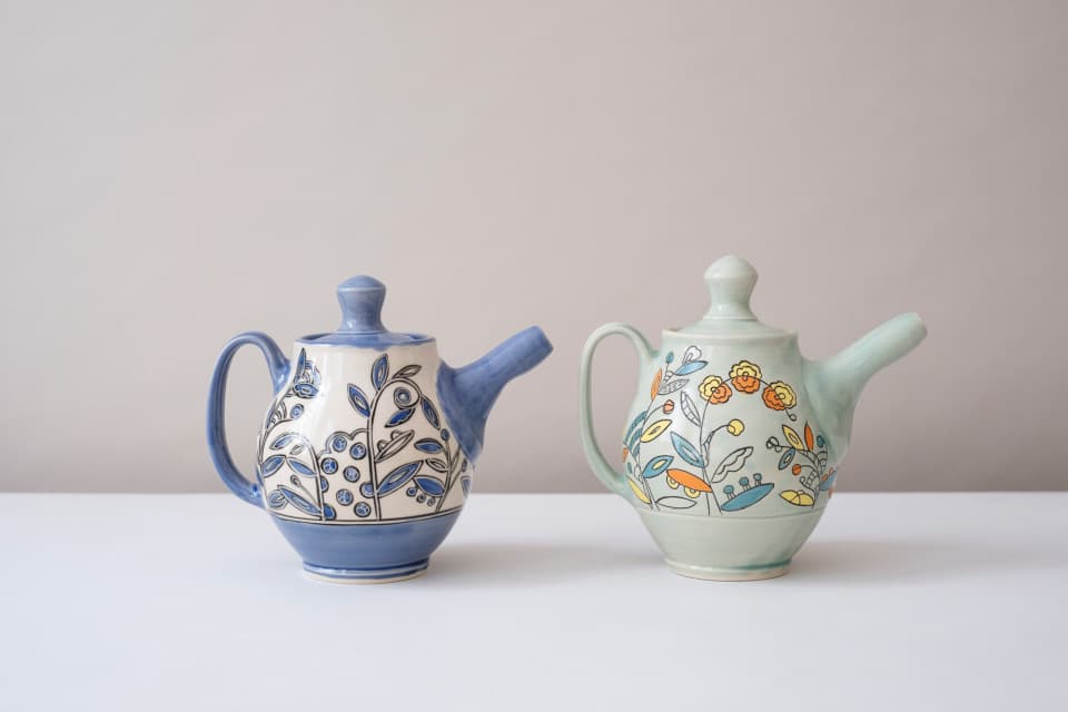Handmade teapot. Wheel-thrown using white stoneware clay. Mishima decoration in a vine pattern and fired to Cone 6. Handmade teapot. Wheel-thrown using white stoneware clay. Mishima decoration in a vine pattern and fired to Cone 6.