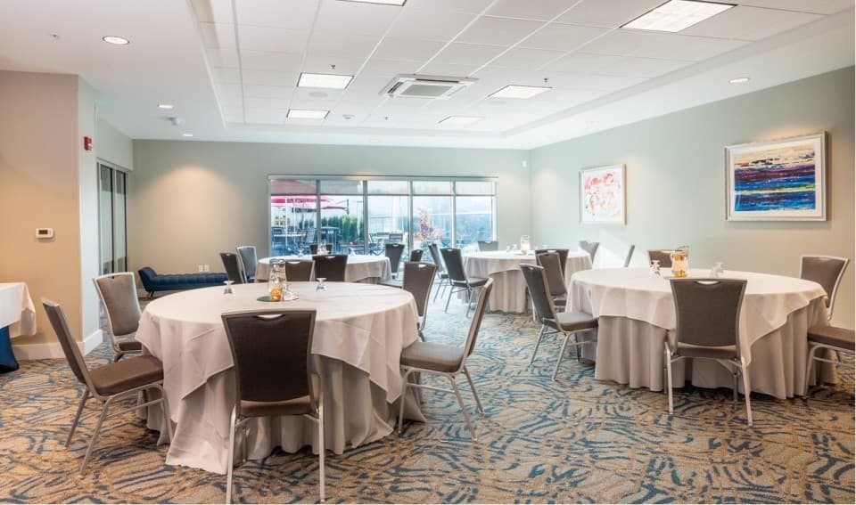 Intimate private meeting room with windows overlooking rooftop bar area; great for social gatherings! Intimate private meeting room with windows overlooking rooftop bar area; great for social gatherings!