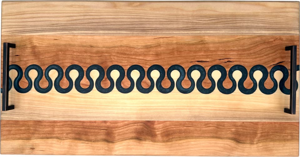 Cherry and maple serving board with Lunar Blue resin. 25 x 13 Cherry and maple serving board with Lunar Blue resin. 25 x 13