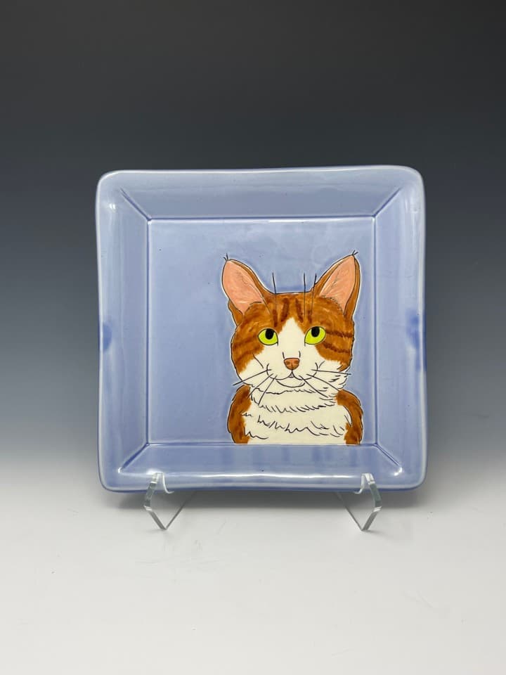 Small square tray with a custom pet. I work from photographs and make a drawing on the clay. Then the pieces is painted. Small square tray with a custom pet. I work from photographs and make a drawing on the clay. Then the pieces is painted.