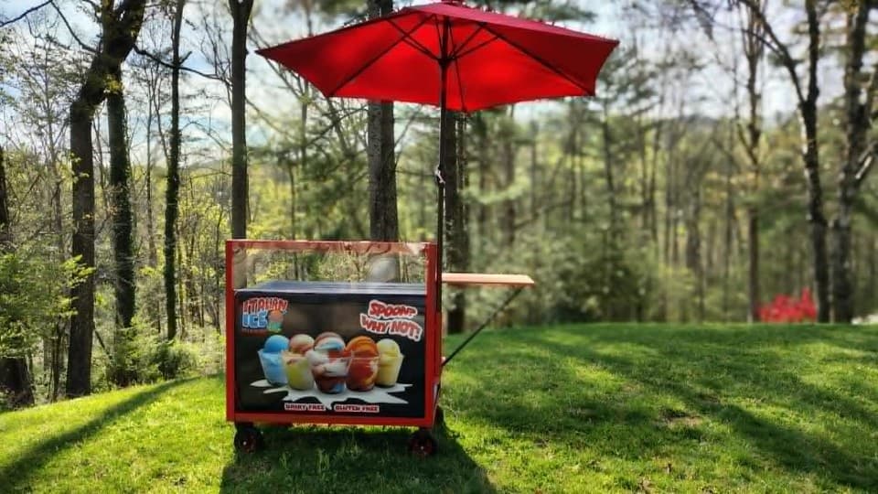Our bright red Italian ice cart ready for action in the beautiful Blue Ridge Mountains near Asheville. Perfect for weddings, fundraisers, mountain gatherings, catering, and community events across Western North Carolina. Dairy-free, gluten-free, and incredibly cream... Like Cream.
Spoon? Why Not! Our bright red Italian ice cart ready for action in the beautiful Blue Ridge Mountains near Asheville. Perfect for weddings, fundraisers, mountain gatherings, catering, and community events across Western North Carolina. Dairy-free, gluten-free, and incredibly cream... Like Cream.
Spoon? Why Not!