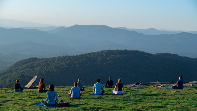 People doing mountaintop yoga on Bearwallow Mountain / Photo: Stephan Pruitt