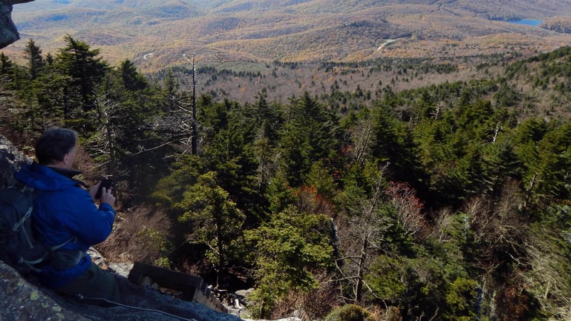 Man on Grandfather Trail sitting soaking in the views Asheville