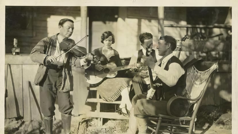 Bascom Lamar Lunsford (left), the celebrated fiddler and ballad collector who recorded at the 1925 Asheville Sessions, pictured with fellow mountain musicians Mr. and Mrs. Lyda Brooks and Gaither Robinson.